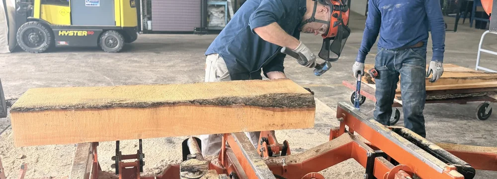 Milling a log on the sawmill at The Mill