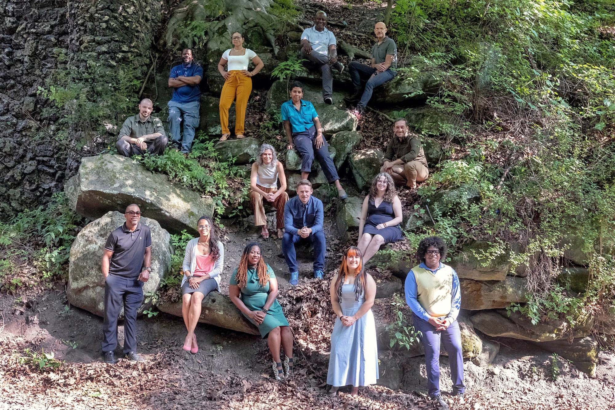 The Landforce staff team gathered on a rocky outcrop in a wooded Pittsburgh park