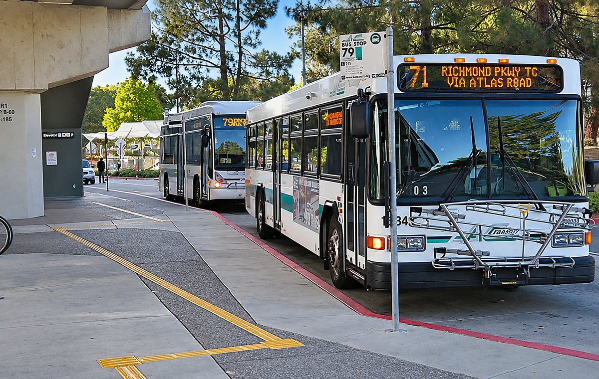 An AC Transit bus signed Richmond Pkwy TC via Atlas Road at a transit centre