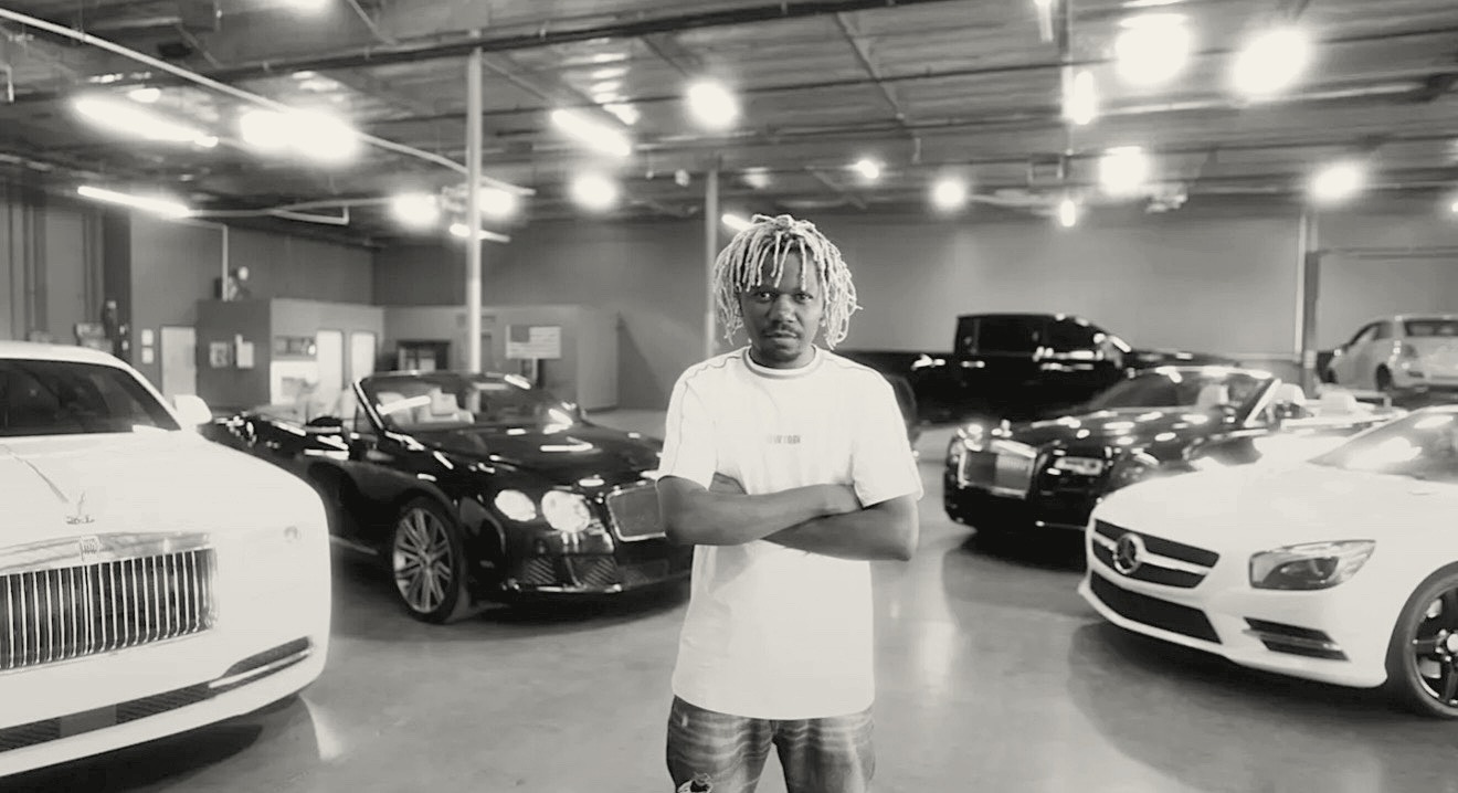 Prince Desire in a luxury car showroom